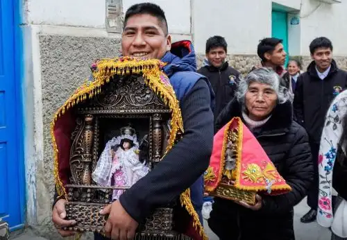 Devotees carrying devotional images during the Virgin of the Rosary festival in Paucartambo